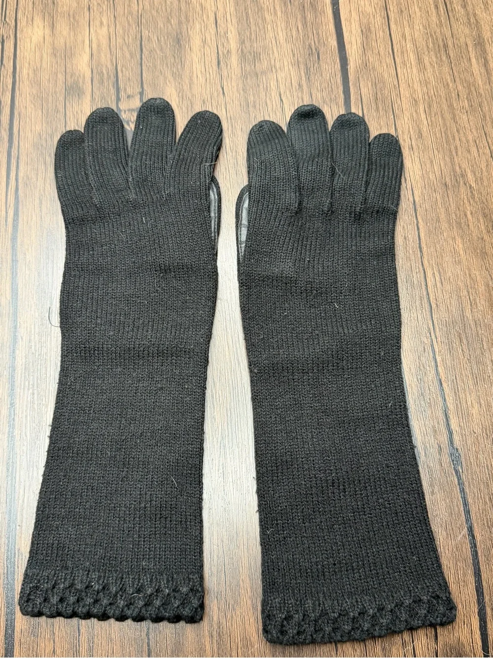 Vintage long black knit gloves featuring a textured cuff